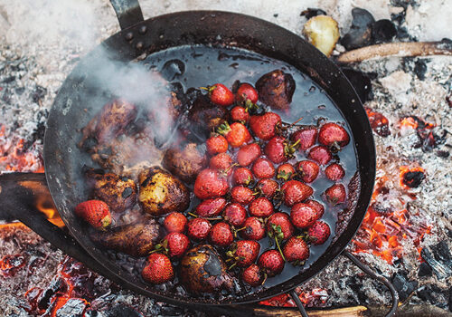 Strawberries and pears on campfire