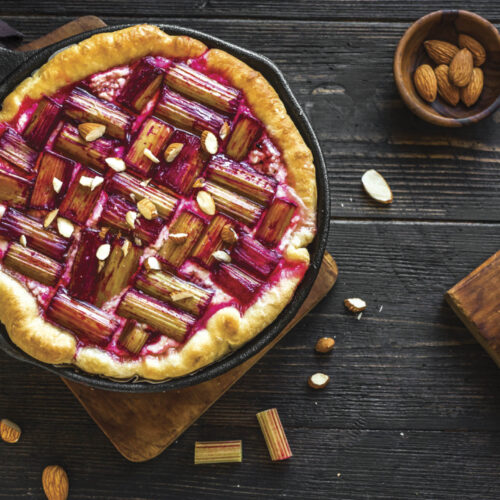 Homemade rhubarb dessert laid out next to ingredients.